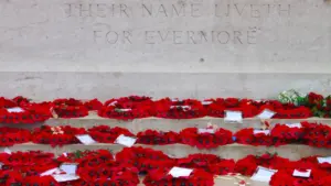 Poppy wreaths laid at a British war memorial for remembrance.